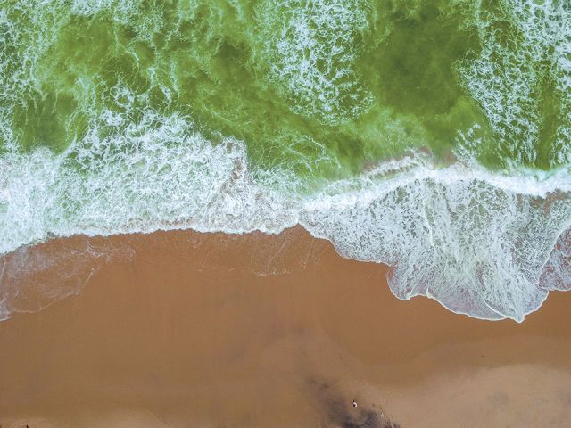 Sand beach aerial, top view of a beautiful sandy beach aerial sh