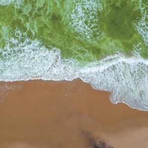 Sand beach aerial, top view of a beautiful sandy beach aerial sh